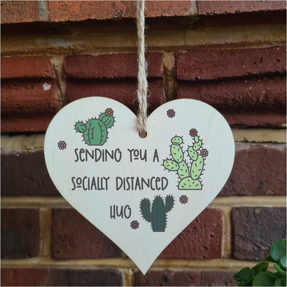 The Plum Penguin Handmade Wooden Hanging Heart Plaque Gift sending you a socially distanced hug miss you long distance novelty wall hanger cute fun cactus design for family friends grandparents